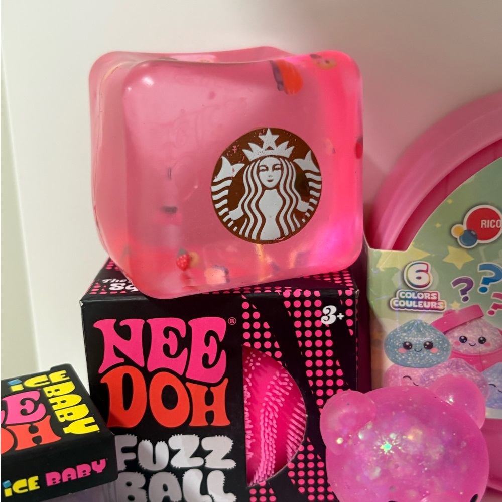 Starbucks Pink Glitter Squishy Cube says “N**doh”’on other side. 1 ITEM.